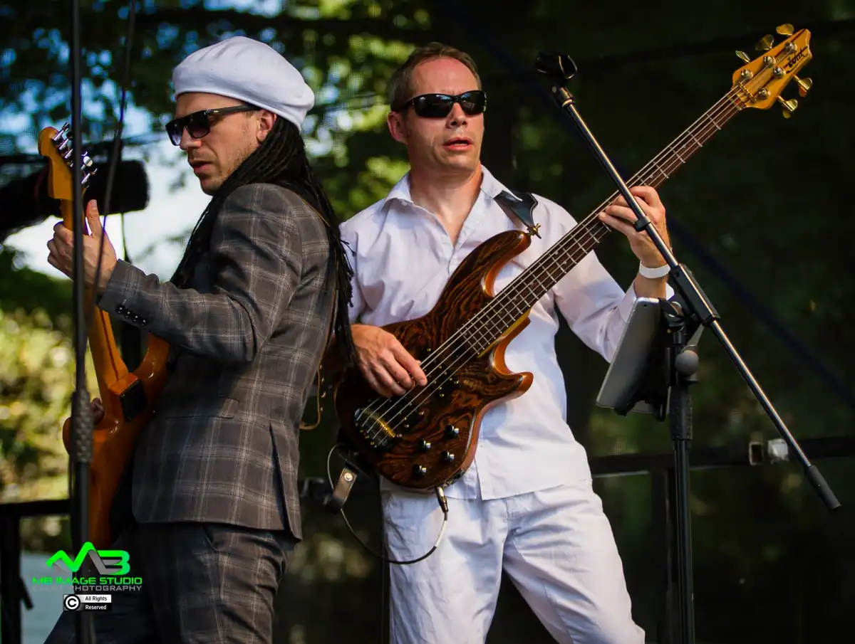 Pete Lindemere playing bass live on stage
